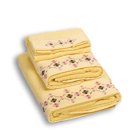 Комплект махровых полотенец из трех предметов хлопок желтый