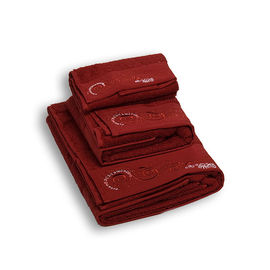 Комплект махровых полотенец из трех предметов хлопок красный