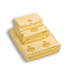 Комплект махровых полотенец из трех предметов хлопок желтый